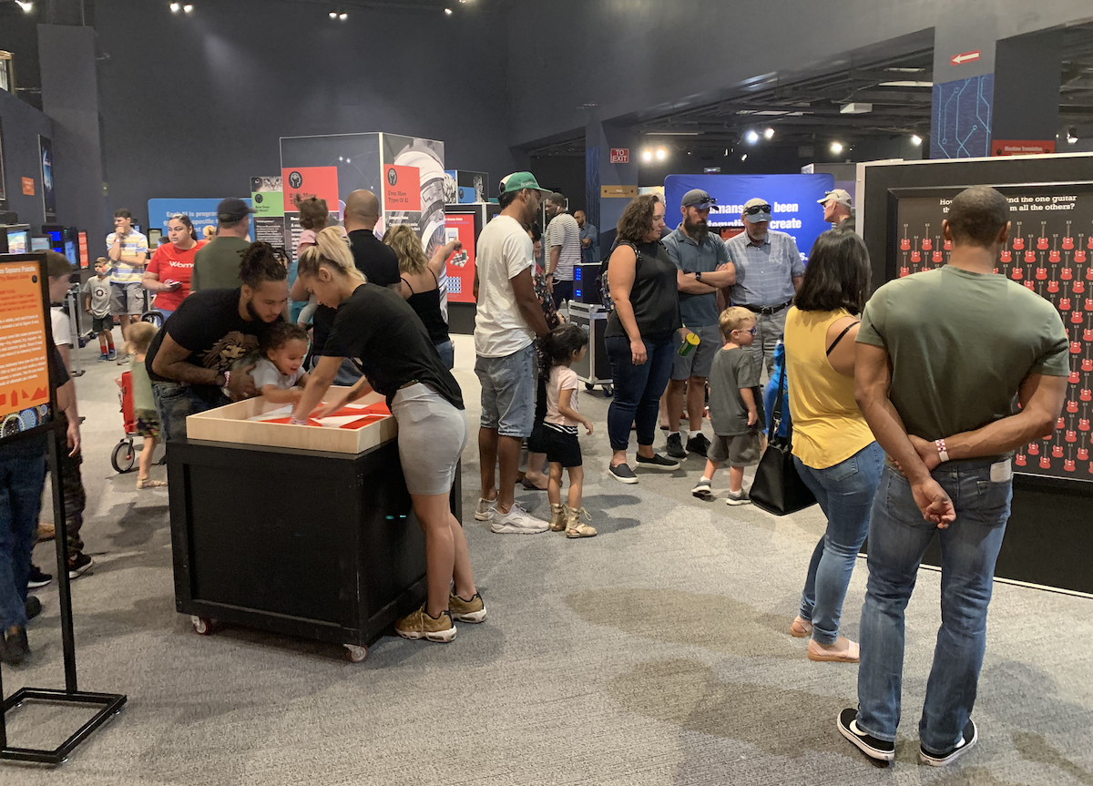Families and visitors at the AI Exhibit