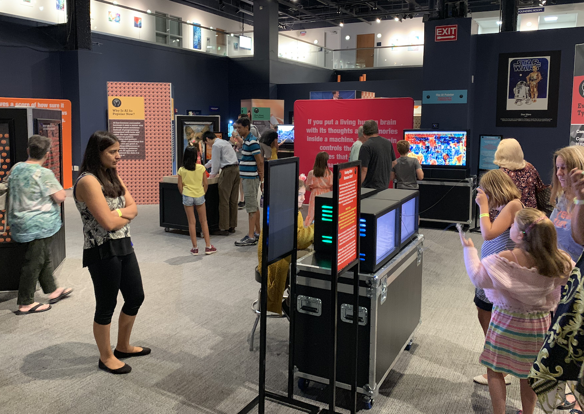 Visitors exploring the AI Exhibit